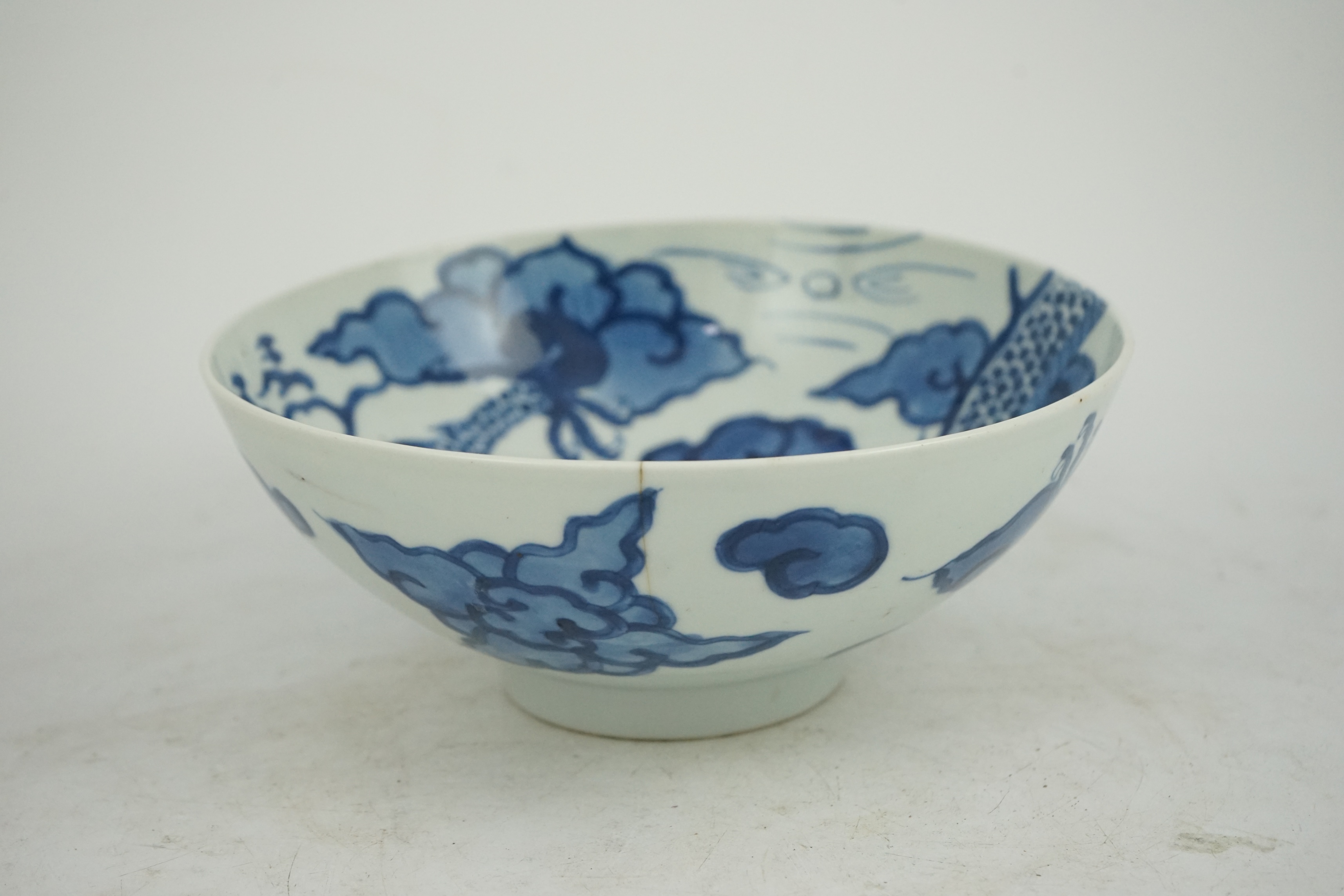 A Chinese blue and white ‘cloud and dragon’ bowl, Yongzheng mark and period (1723-35)